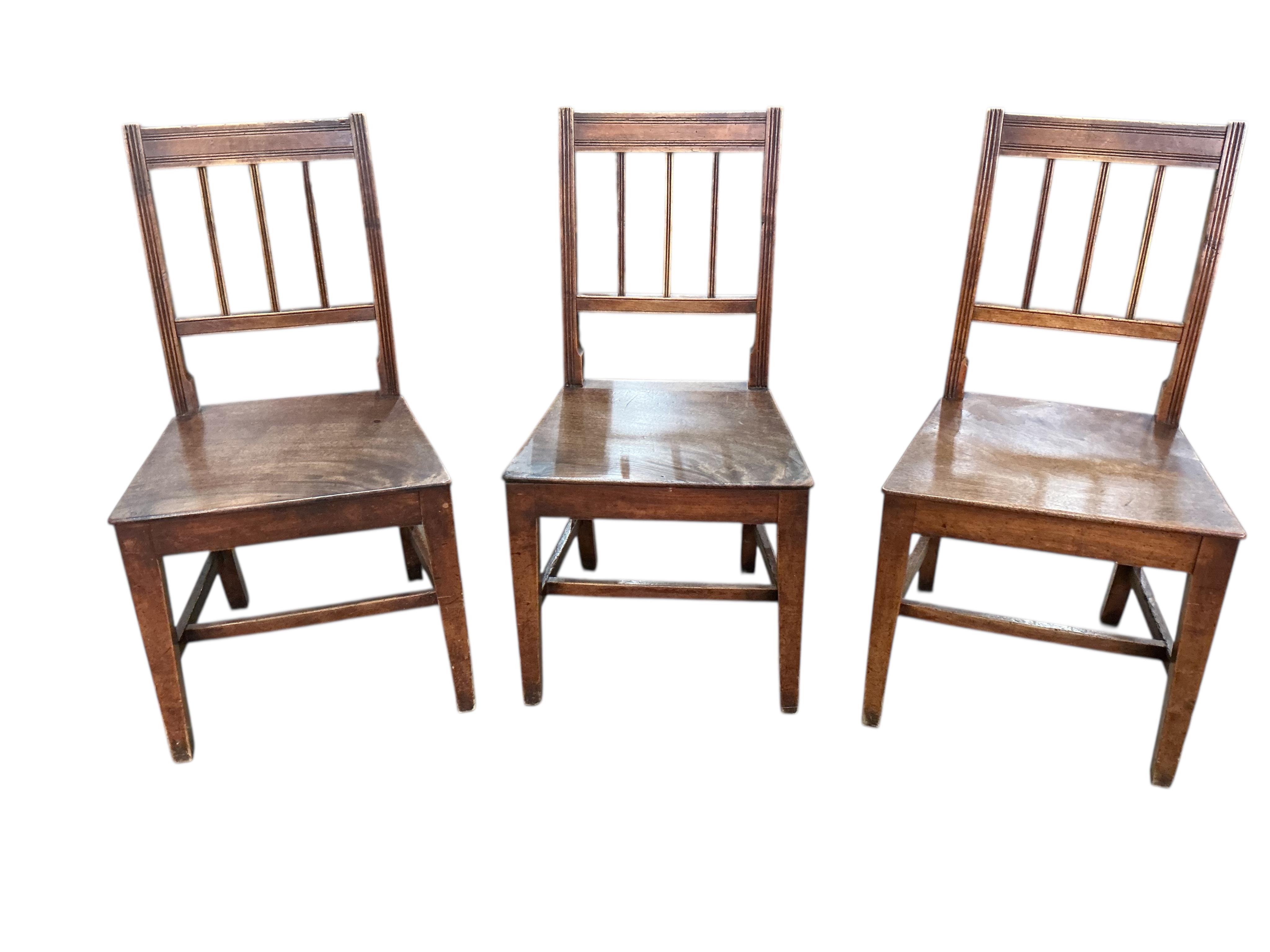 A set of six George III Provincial fruitwood and mahogany dining chairs